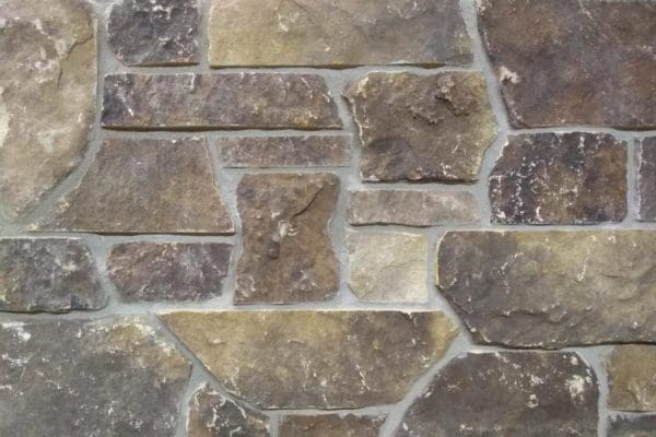 mock up of brown natural stone veneer sawn on the top and bottom