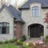 Front Entrance, Accent Wall, and Chimney with Charcoal Bluff Real Thin Stone Veneer