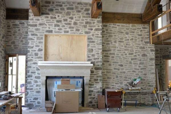 Living Room with Charcoal Bluff Overgrout Interior Walls and Fireplace
