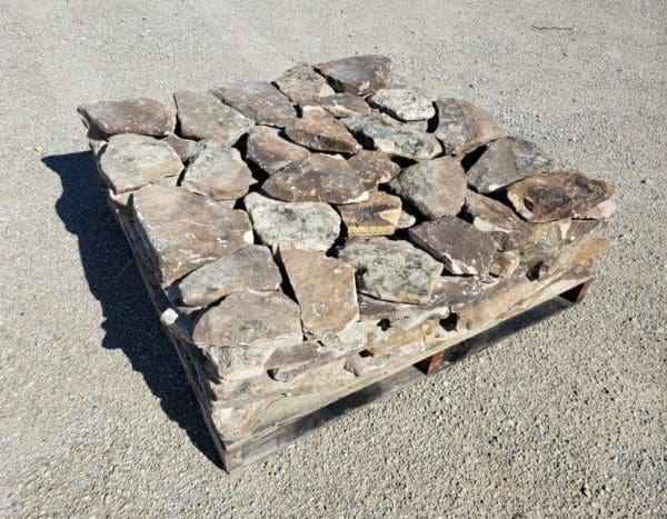 A stock pallet of moss rock natural thin stone veneer