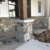Exterior wainscoting and pillars with Whistler real stone veneer
