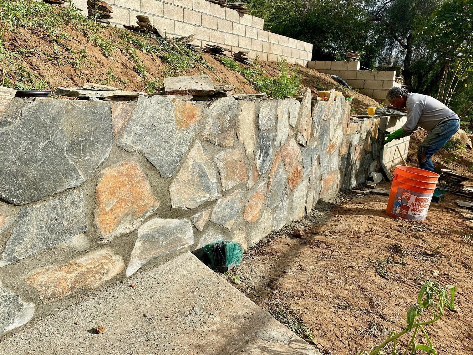 Close up of grey and tan stone on a retaining wall