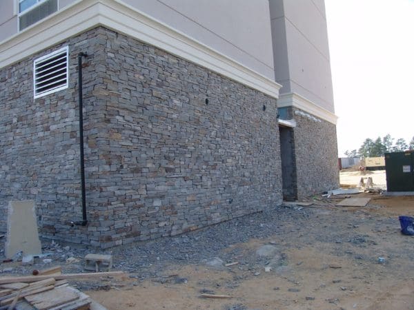 Commercial installation in progress with Augusta real thin stone veneer exterior siding