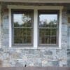 Covered patio exterior wall with Bayside and Augusta real thin stone veneer