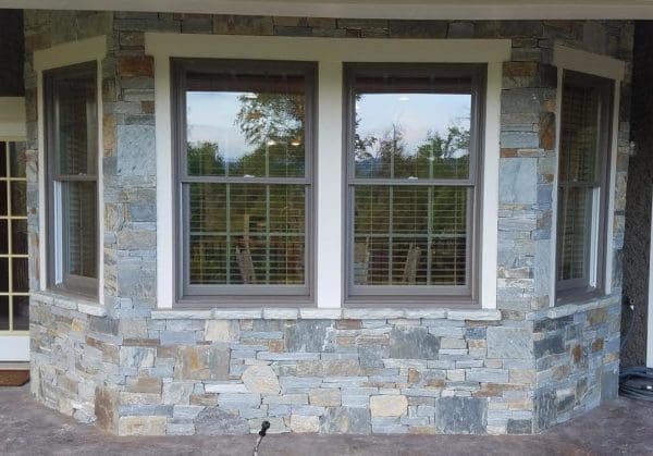 Covered patio exterior wall with Bayside and Augusta real thin stone veneer