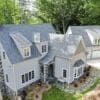 Birds eye view of home with Carlisle real stone veneer chimney, wainscoting, and front entrance