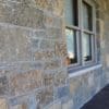 Front porch accent wall with Castle Ridge and Baltic Hills natural stone veneer