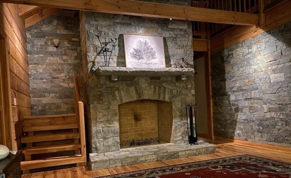 Living room interior walls and fireplace with Coventry natural stone veneer