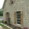 Cottage exterior with Portofino tumbled ashlar real thin stone veneer