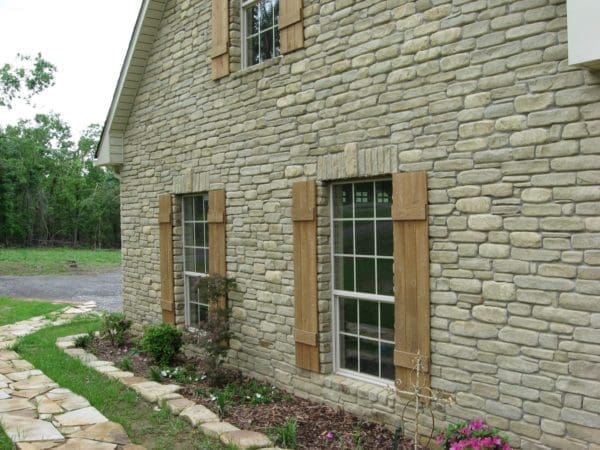 Cottage exterior with Portofino tumbled ashlar real thin stone veneer