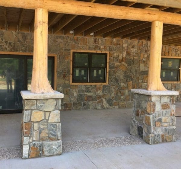Covered patio with Rochester castle rock style real thin stone veneer