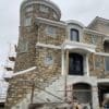 Exterior siding with Annapurna ashlar style natural thin stone veneer