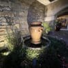 Cabernet Natural Stone Veneer Exterior with Fountain at Twilight