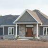Jacksonport and Pembroke Natural Stone Veneer Blend Exterior with White Mortar