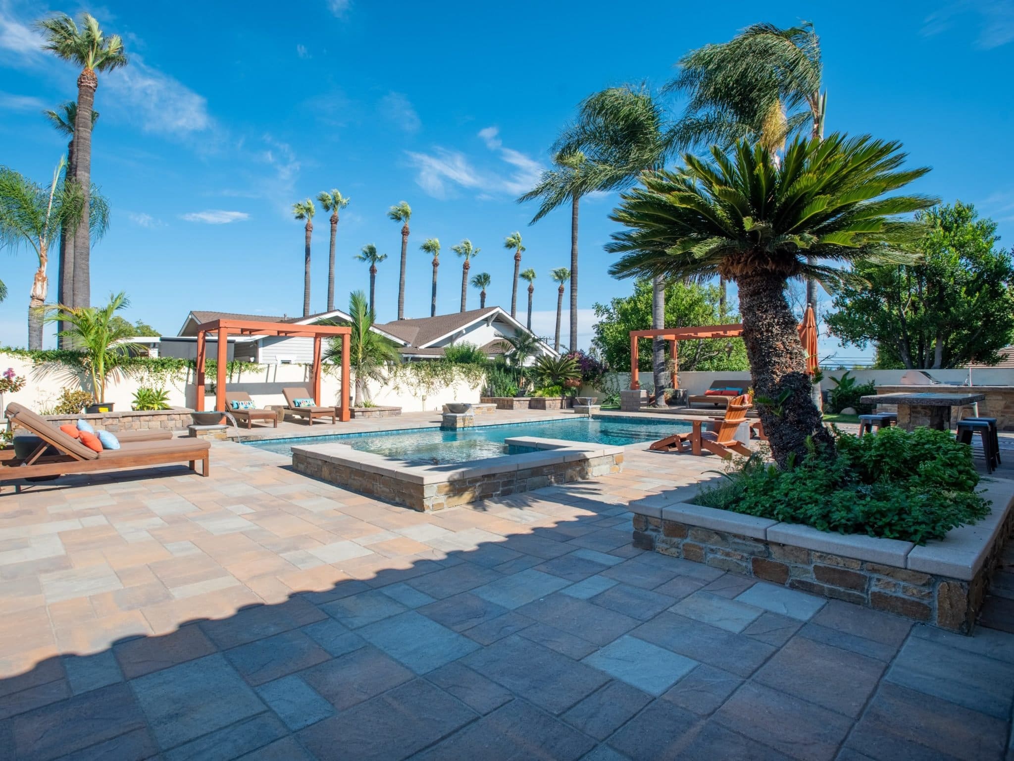 Outdoor Living Pool and Spa with Cabernet Natural Stone Veneer