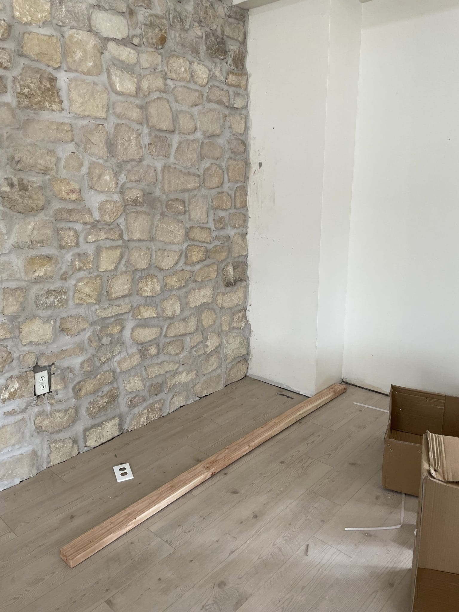 Limestone being installed on an indoor wall