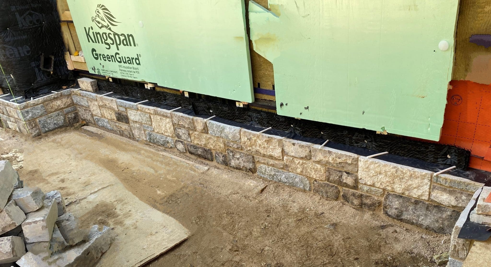 Jacksonport Custom Tumbled Natural Thin Stone Veneer Wainscoting Installation in Progress
