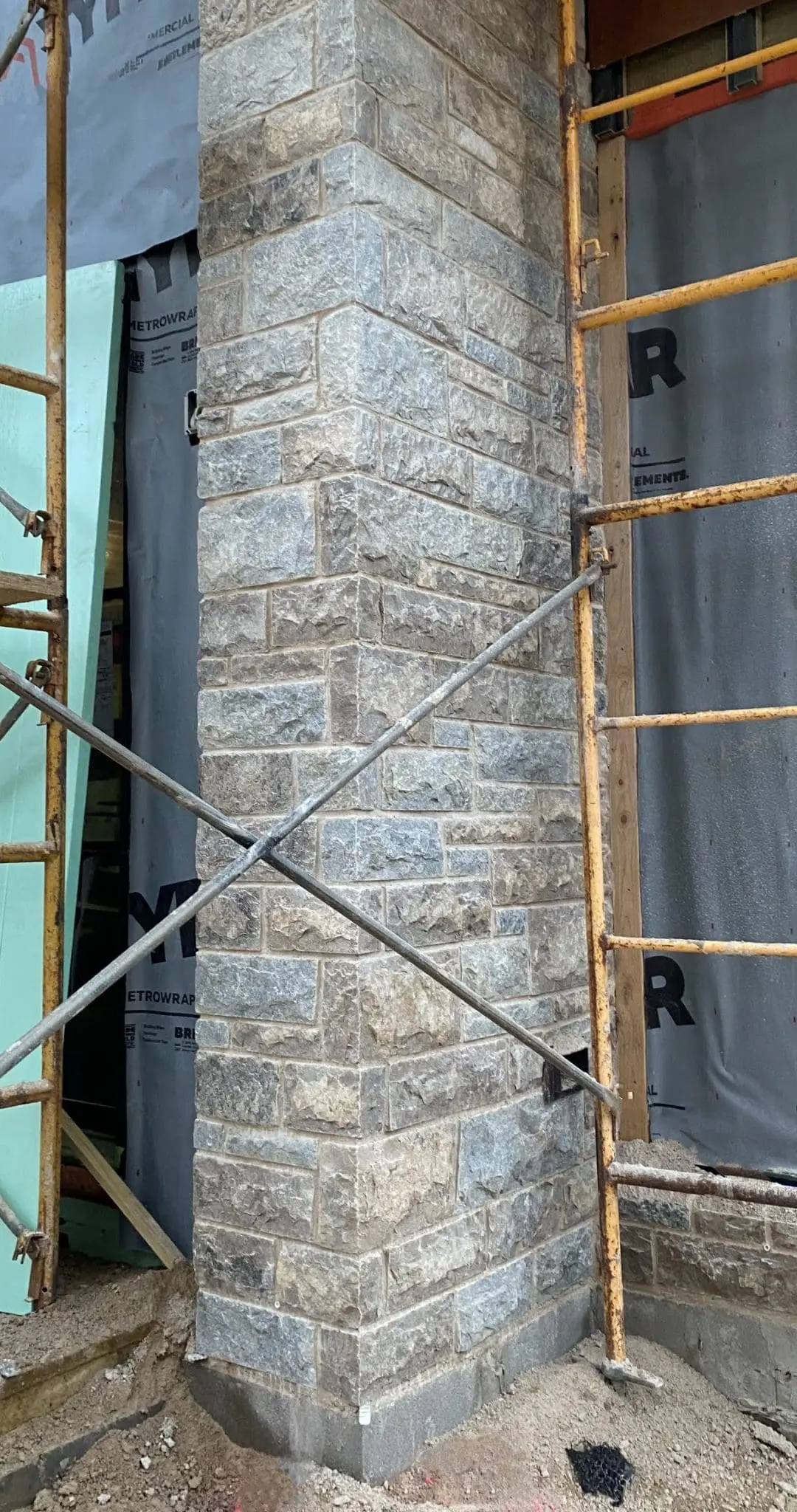 Jacksonport Custom Tumbled Real Thin Stone Veneer Installation in Progress